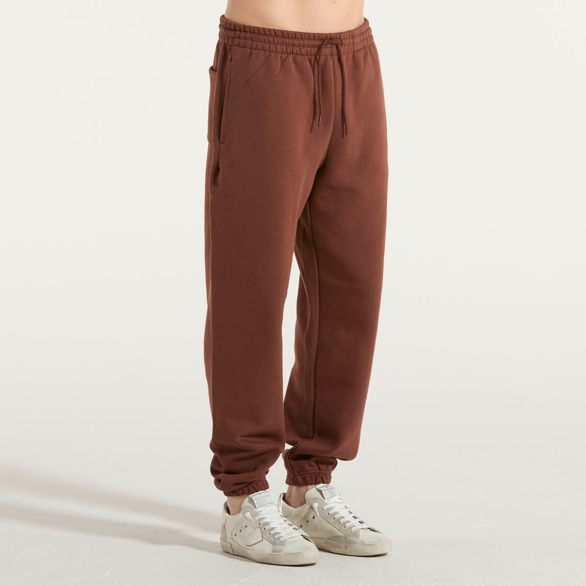 New Balance pantalone jogger tessuto ruggine